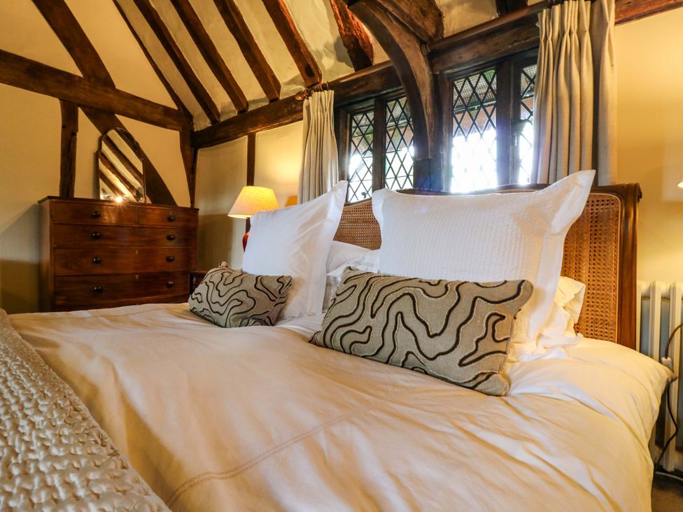 A bedroom with a bed and dresser at Dukes Place