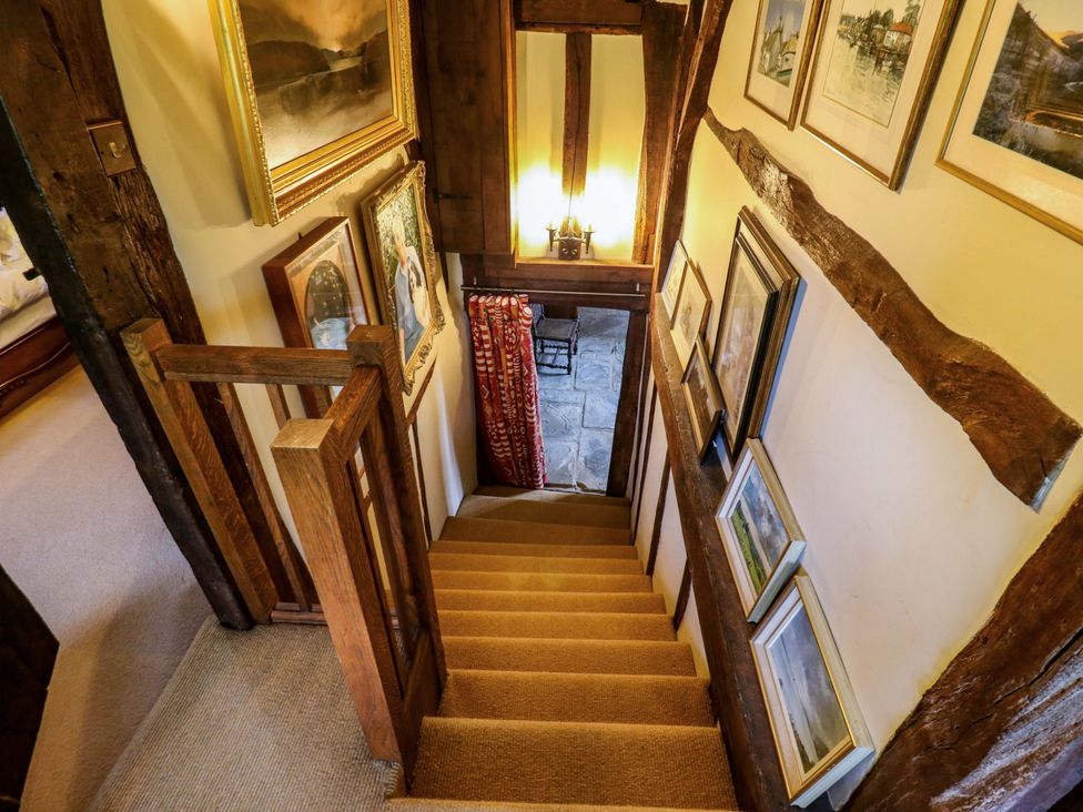 A staircase with pictures on the wall at Dukes Place