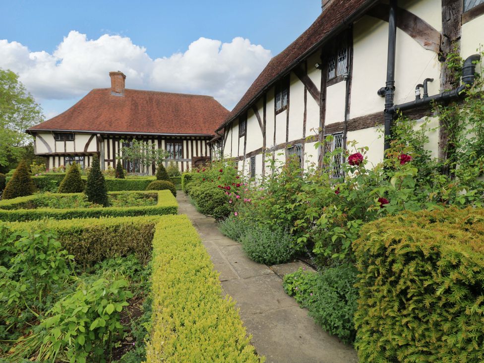A house with a garden and pathway at Dukes Place 
