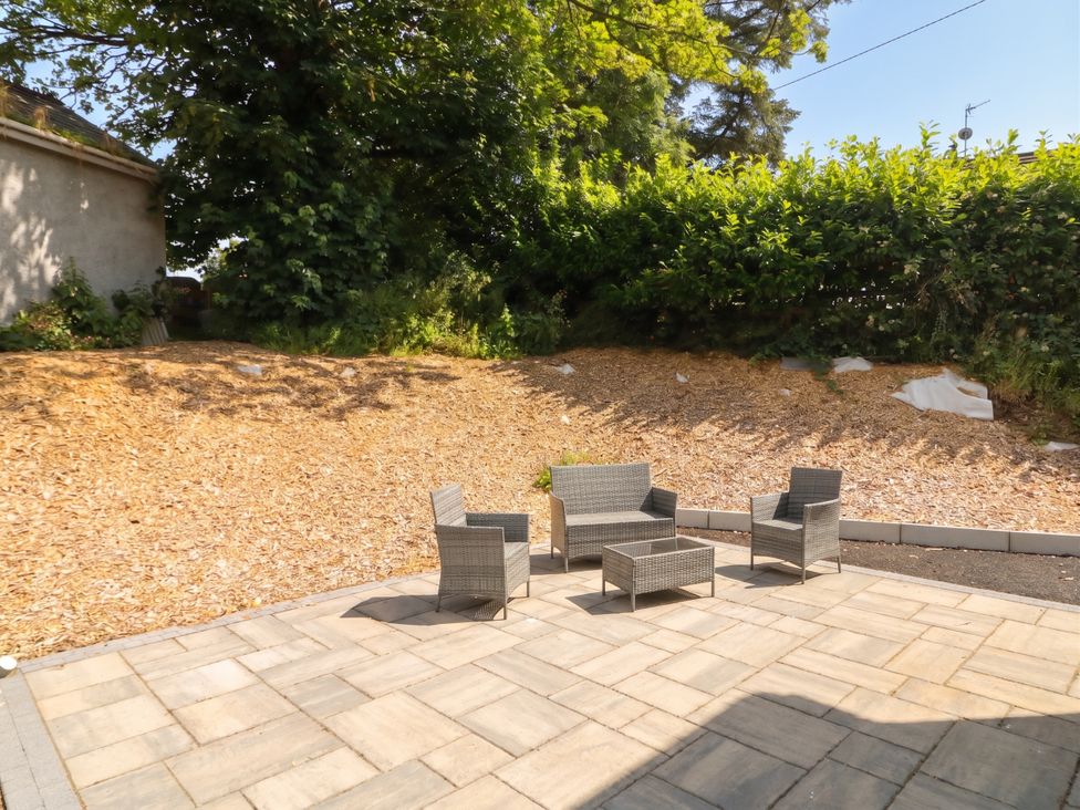 A patio area with seating at Brook Cottage in Moneydig near Coleraine