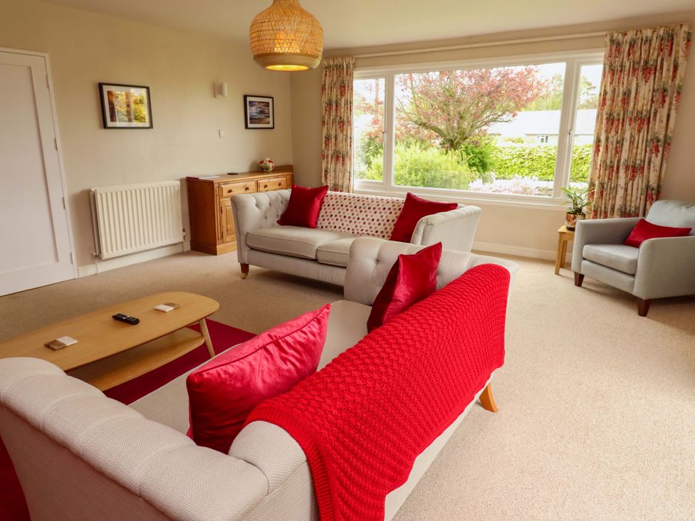 A living room with sofas and a coffee table at Campden in Rennington near Embleton