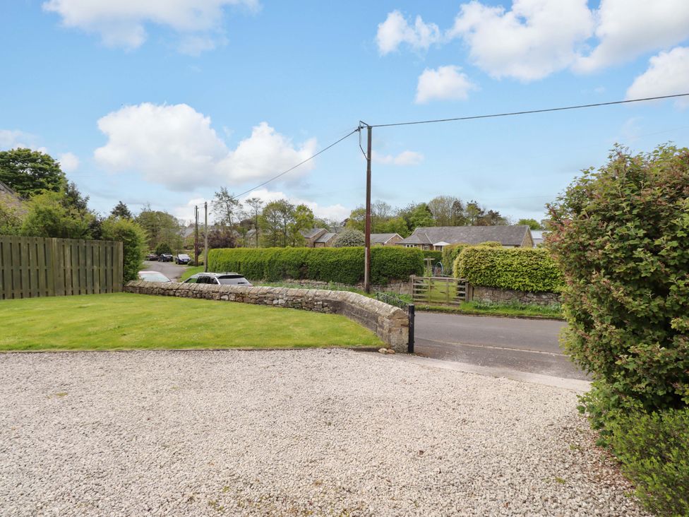A view of the roadside with grass and gravel at Campden in Rennington near Embleton