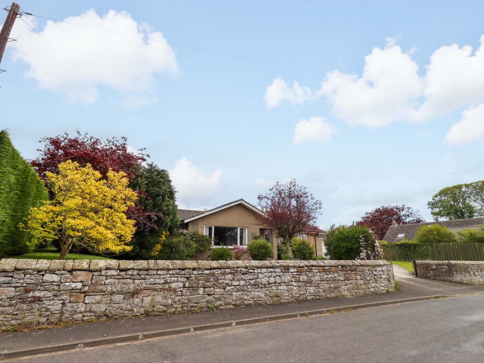 A house with garden and trees at Campden Rennington near Embleton