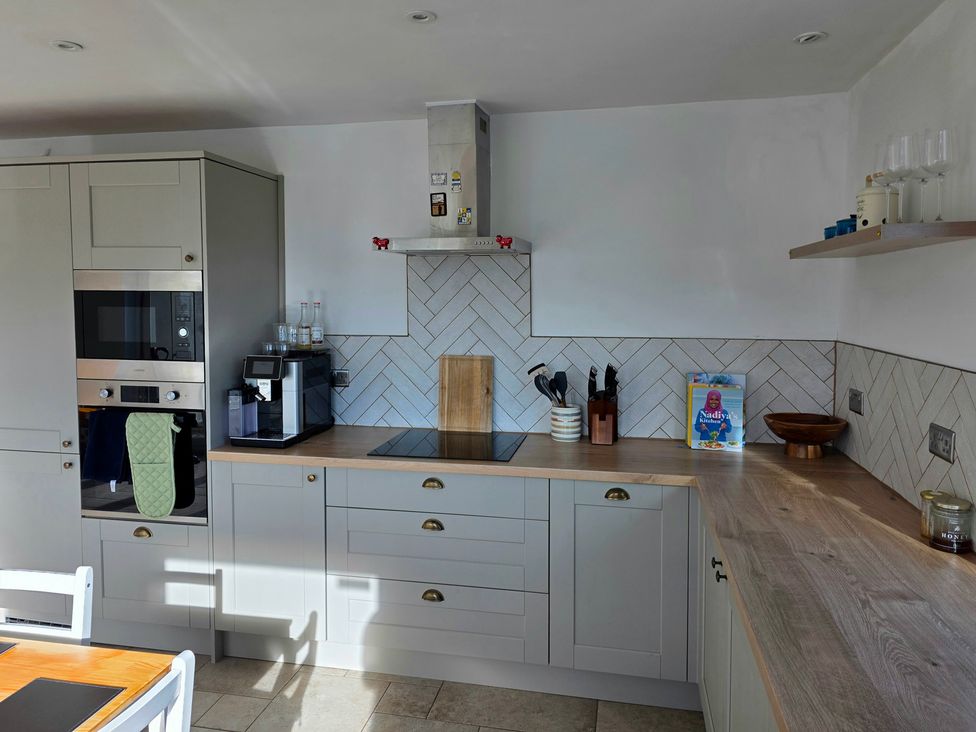 A kitchen with a coffee maker and oven at Pant in Holyhead