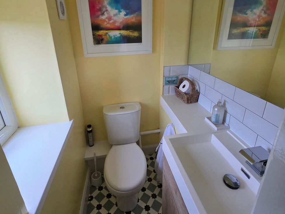 A bathroom with a toilet and sink at Pant in Holyhead