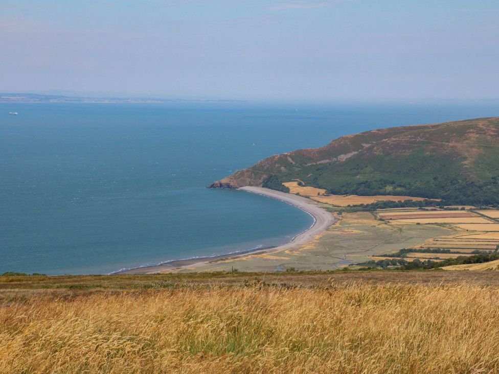 A beach coastline with hills and fields at Pete's Place in Taunton