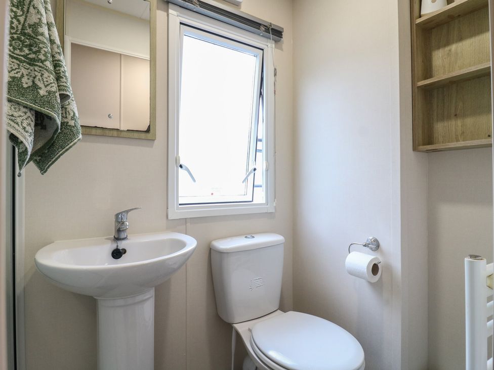 A bathroom with a sink and toilet at Forest Retreat - FO26 in Saxmundham