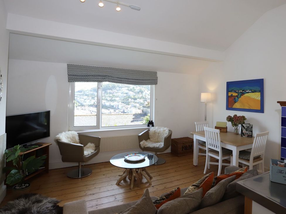 A living room with a window and furniture at Dart Views in Dartmouth
