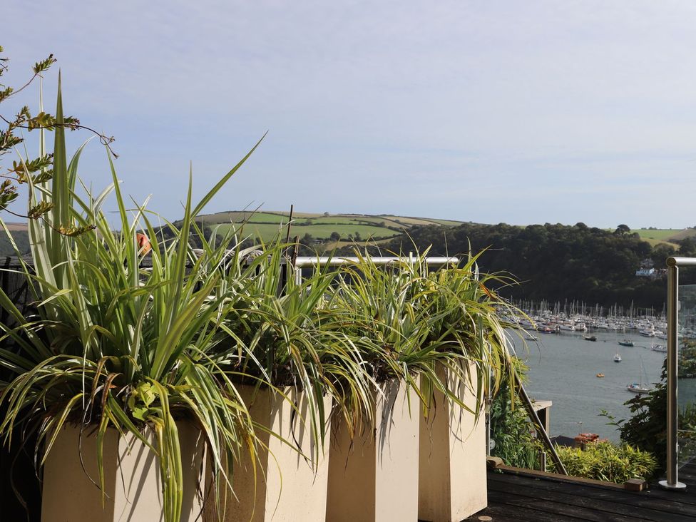 A view of plants in pots overlooking a marina at Dart Views in Dartmouth