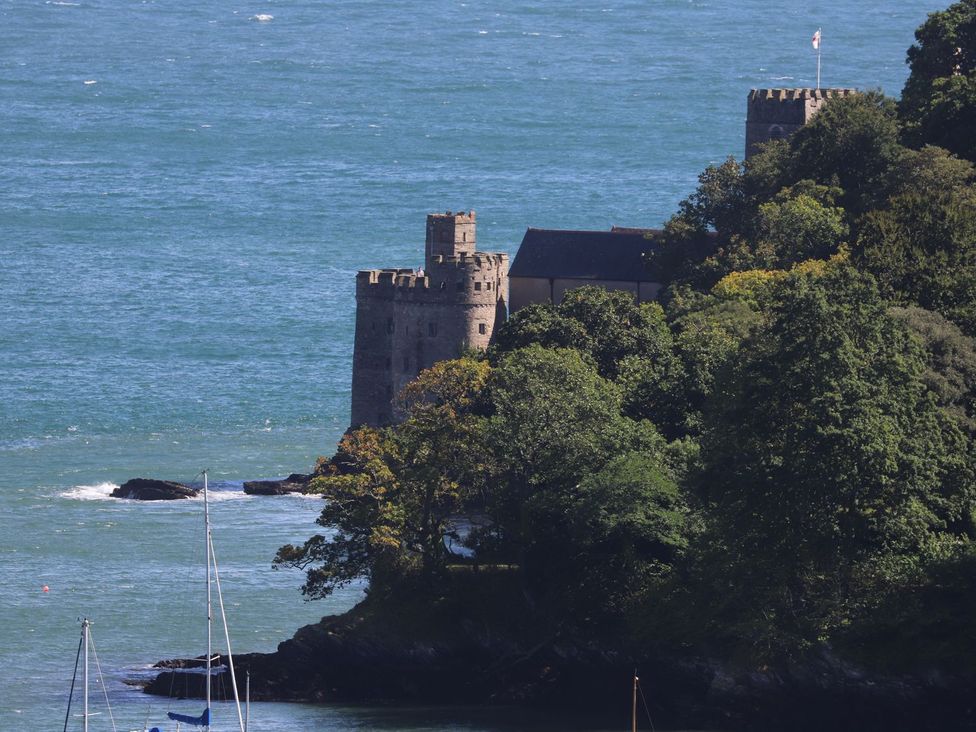 A castle near the ocean surrounded by trees at Dart Views in Dartmouth