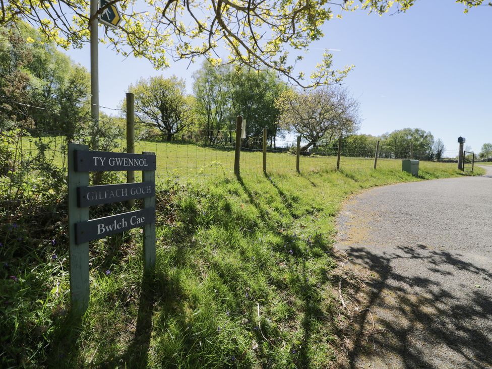A sign for Ty Gwennol and Gilfach Goch on a road in Llanbedr