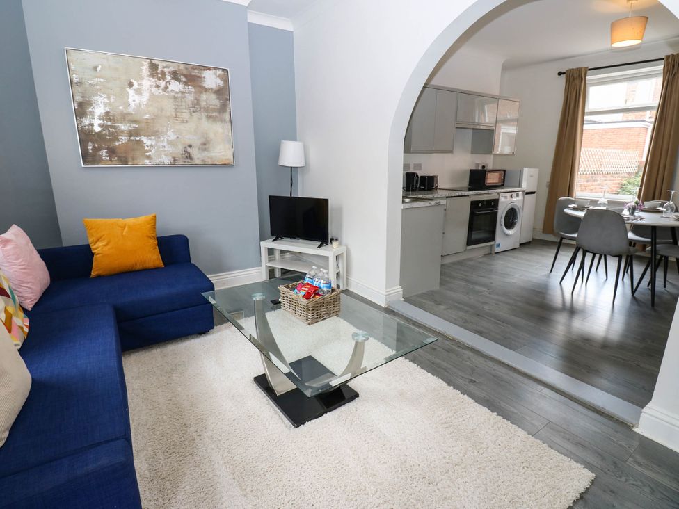 A living room with a sofa and table at 22 Prospect Terrace in Brancepeth