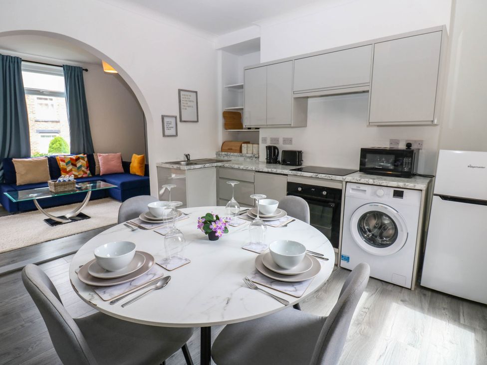 A kitchen and dining area with a table and chairs at 22 Prospect Terrace in Brancepeth