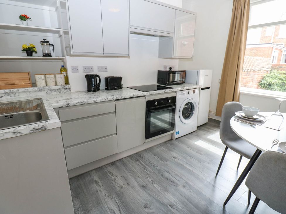 A kitchen with appliances and seating at 22 Prospect Terrace in Brancepeth