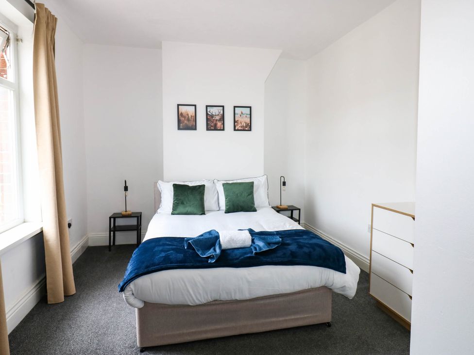 A bedroom with a bed and bedside tables at 22 Prospect Terrace Brancepeth