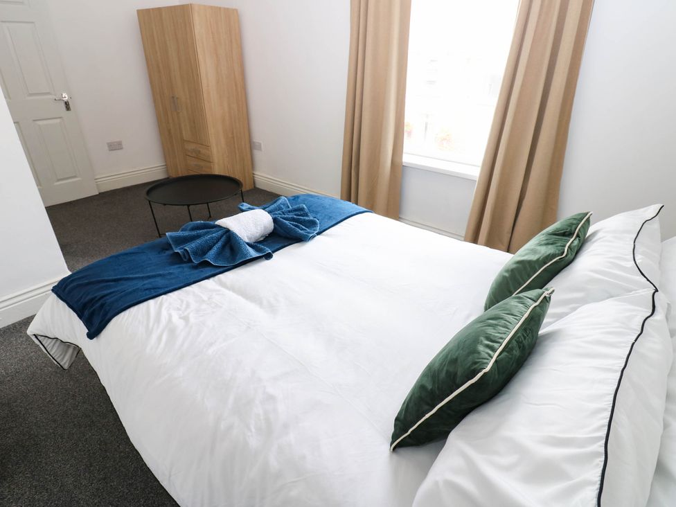 A bedroom with a bed and wardrobe at 22 Prospect Terrace in Brancepeth