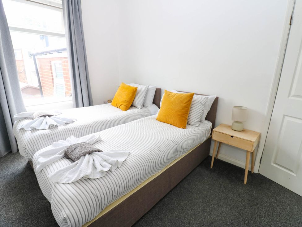 A bedroom with twin beds and a bedside table at 22 Prospect Terrace in Brancepeth