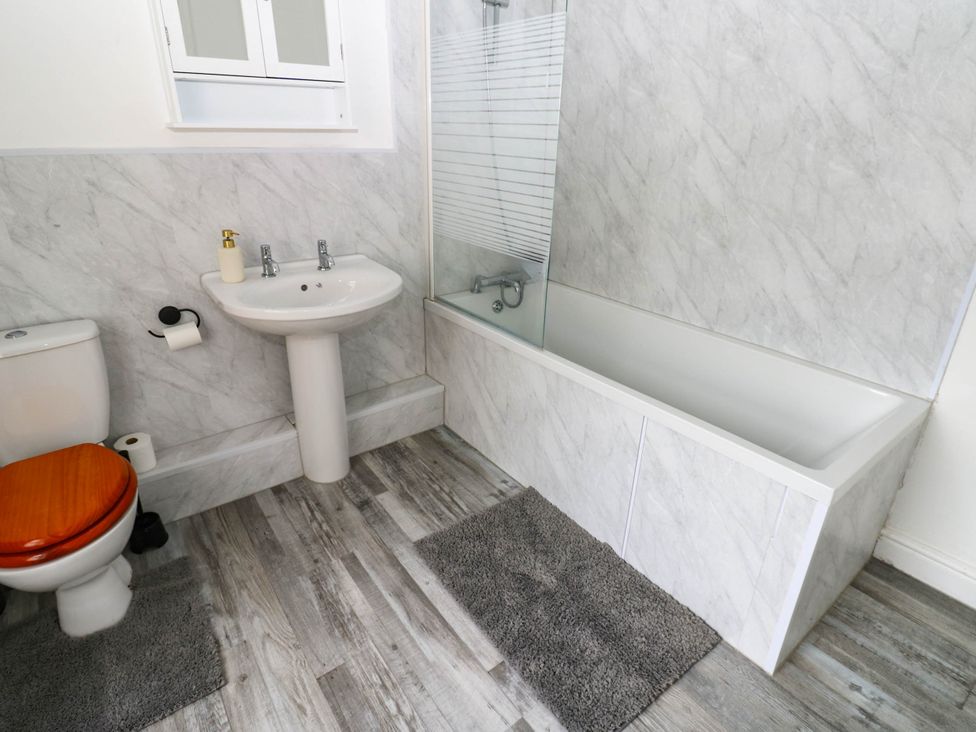 A bathroom with a sink, toilet, shower, and bathtub at 22 Prospect Terrace in Brancepeth
