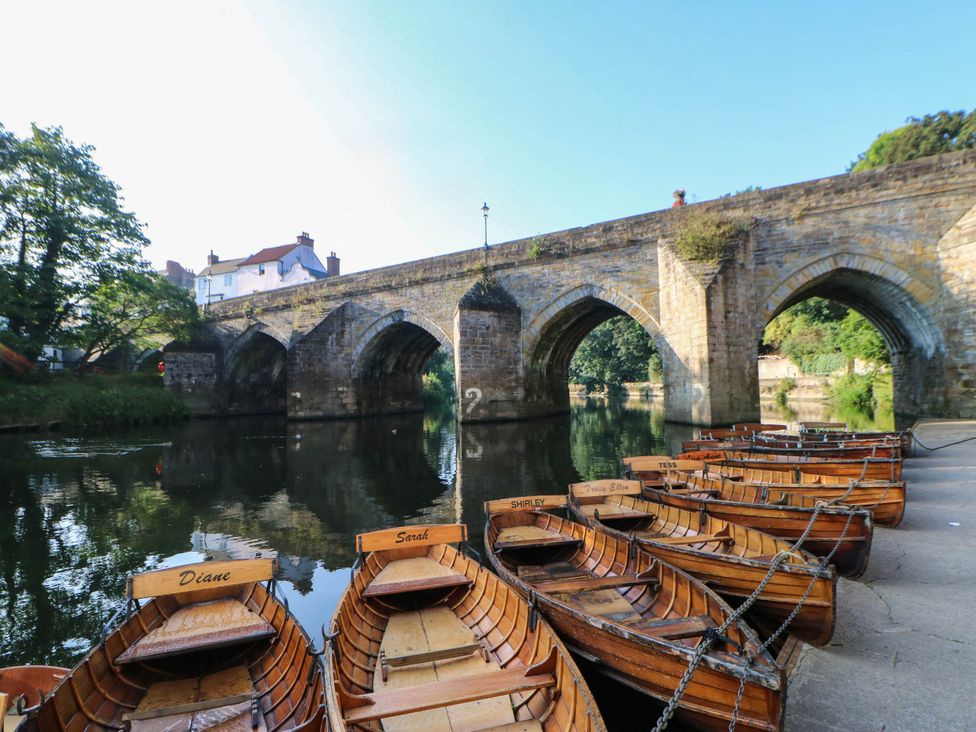 A view of a bridge with boats on the water at 22 Prospect Terrace, Brancepeth