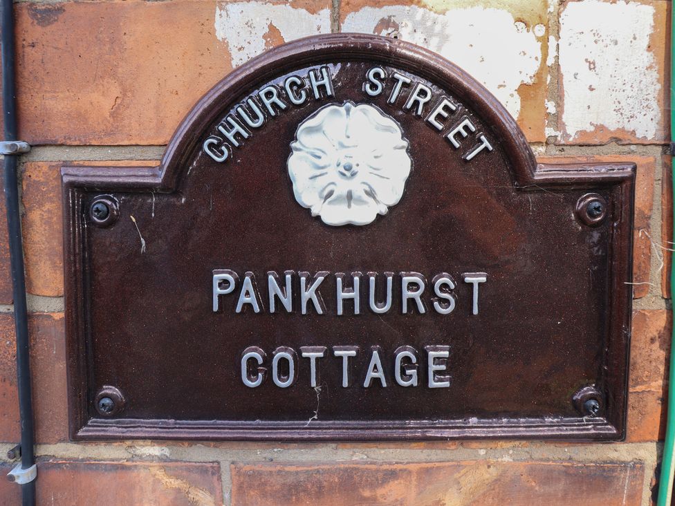 A nameplate for Pankhurst Cottage on Church Street in Louth