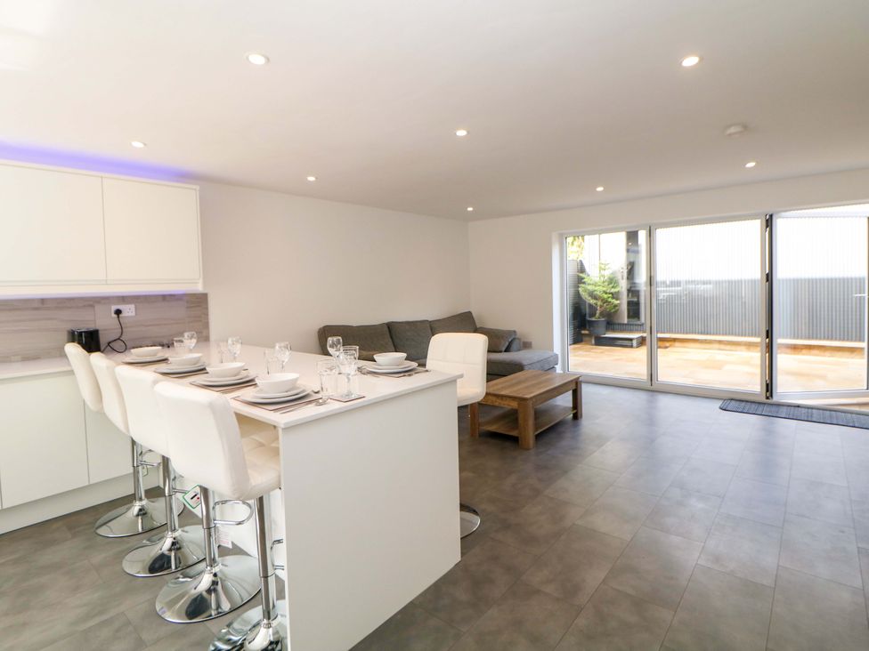 A living room with a sofa and table at 49 Rushley Road Sheffield