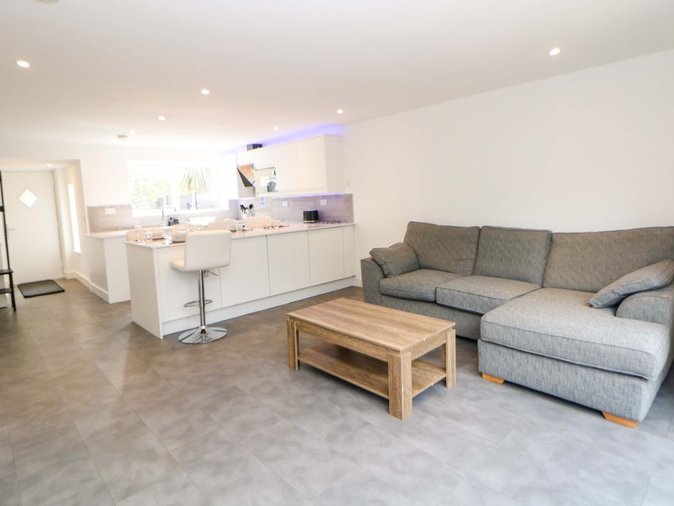 A living room with a couch and coffee table at 49 Rushley Road, Sheffield