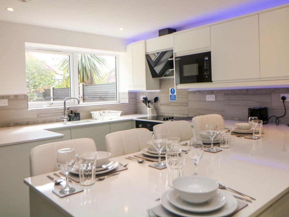 A kitchen with a table set for dinner at 49 Rushley Road in Sheffield