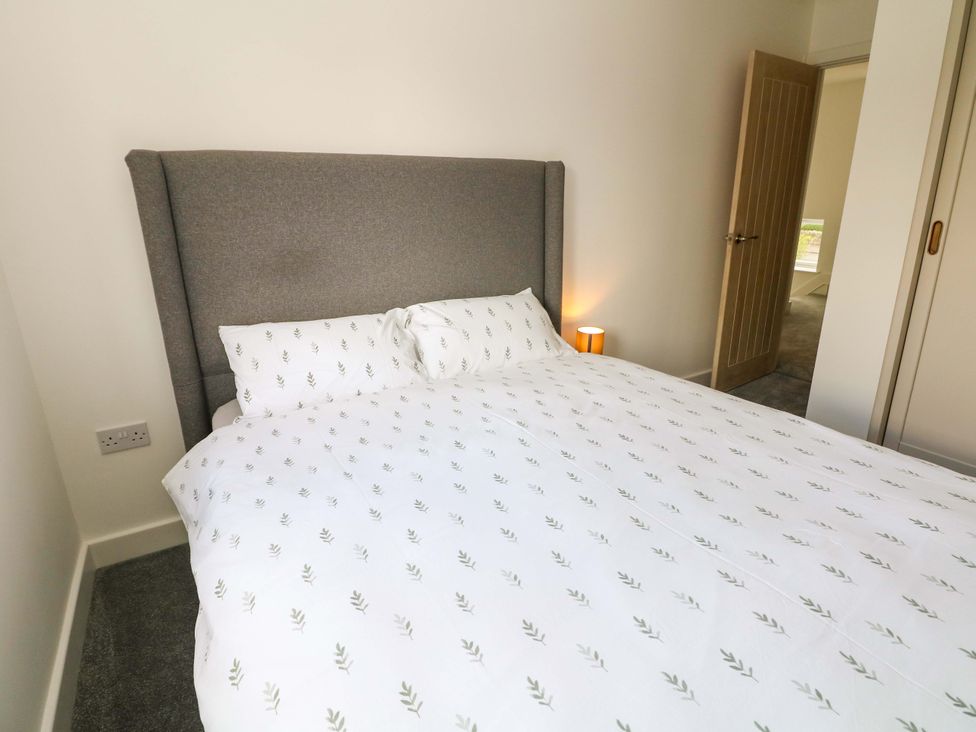 A bedroom with a bed and lamp at 49 Rushley Road Sheffield