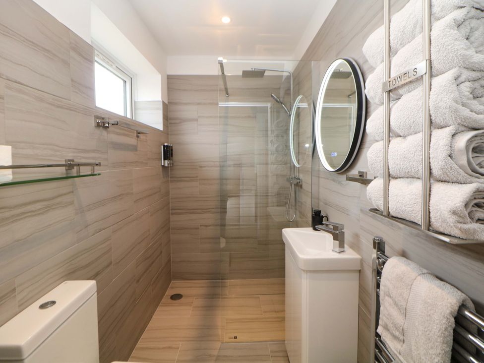 A bathroom with a shower and sink at 49 Rushley Road in Sheffield