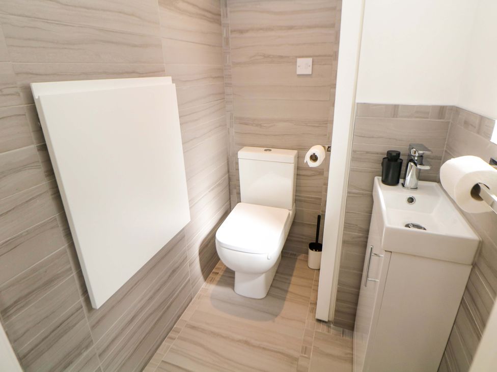 A bathroom with a toilet and sink at 49 Rushley Road, Sheffield