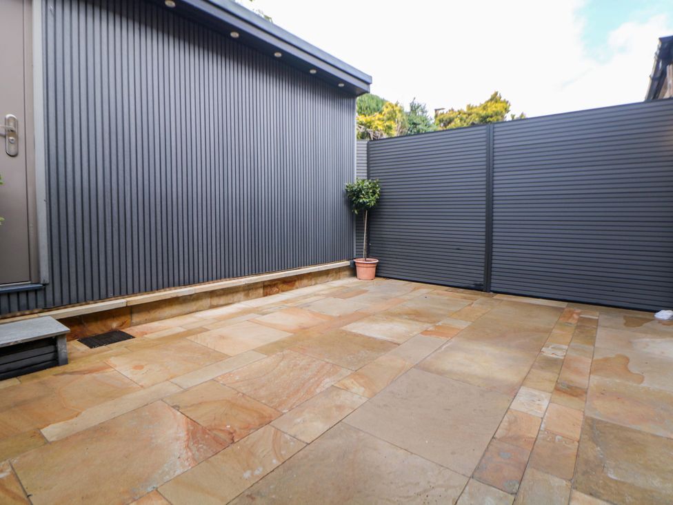 An outdoor area with paving stones and a plant pot at 49 Rushley Road Sheffield