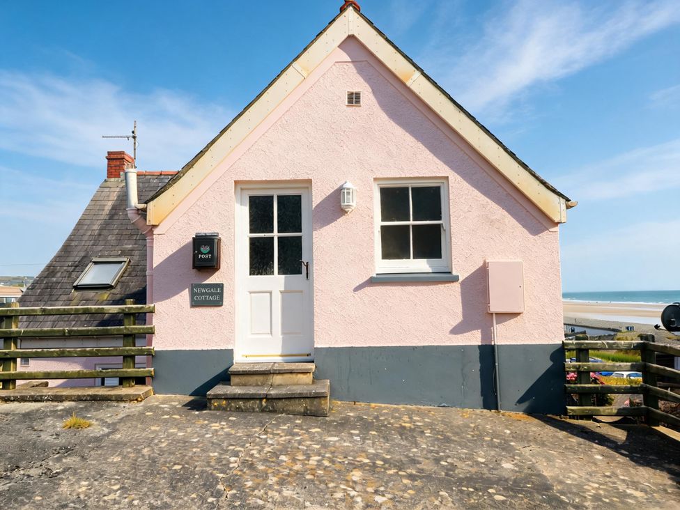 An exterior view of Newgale Cottage in Newgale with a door and window shown