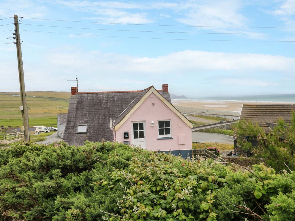 A house with a garden and road at Newgale Cottage in Newgale