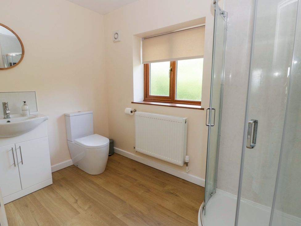 A bathroom with a shower and sink at Yr Onnen