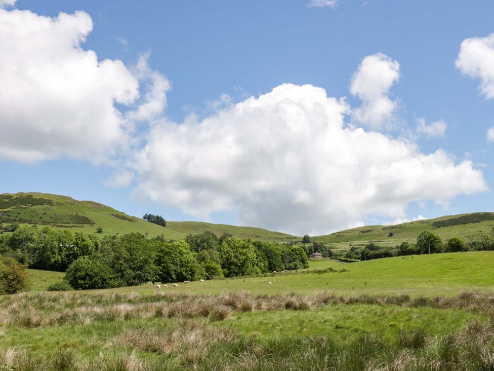 A scenic landscape with hills and trees at Yr Onnen