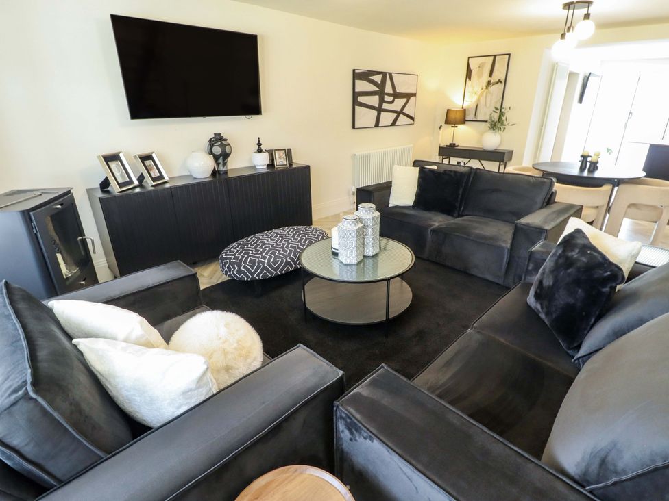 A living room with sofas, a coffee table, and a television at 21 Anderby road