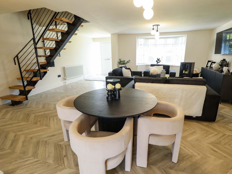 A living room with a staircase and furniture at 21 Anderby road