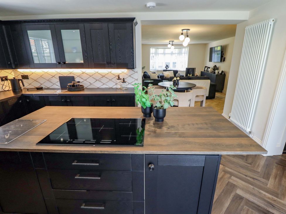 A kitchen with an island and stove at 21 Anderby road