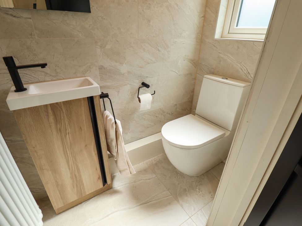A bathroom with a sink and toilet at 21 Anderby road 