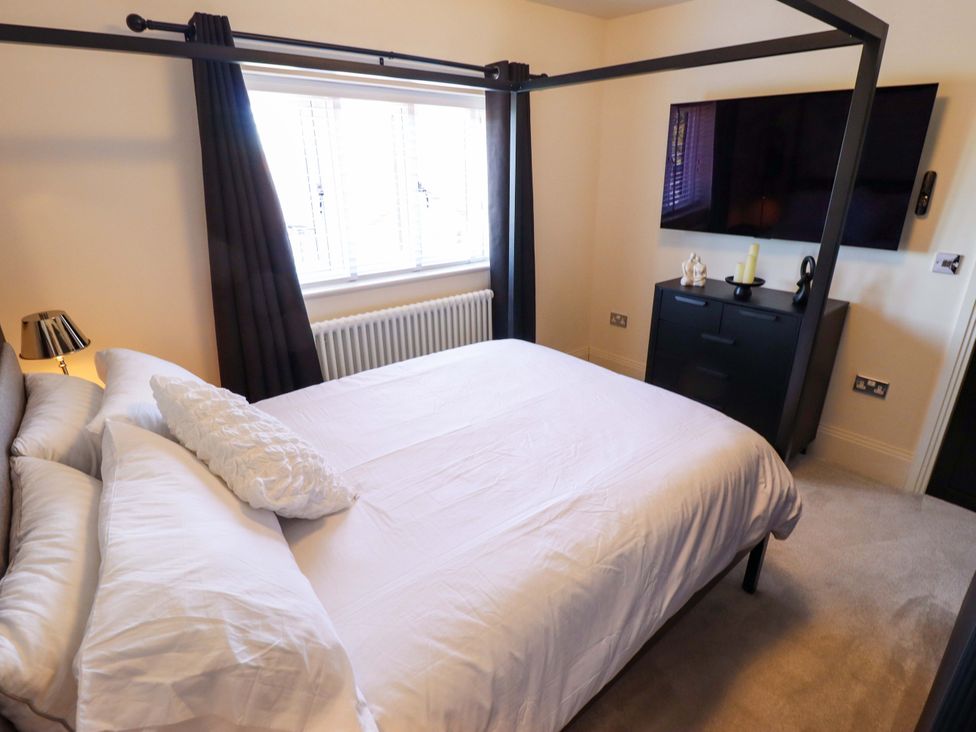 A bedroom with a bed and television at 21 Anderby road