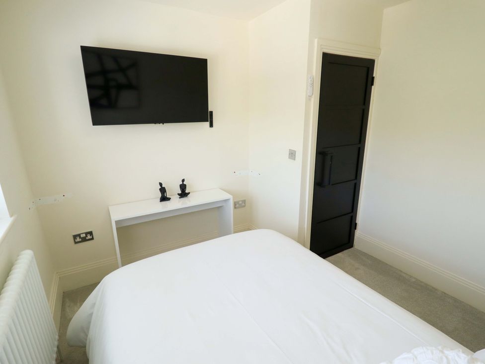 A bedroom with a television and a bed at 21 Anderby road