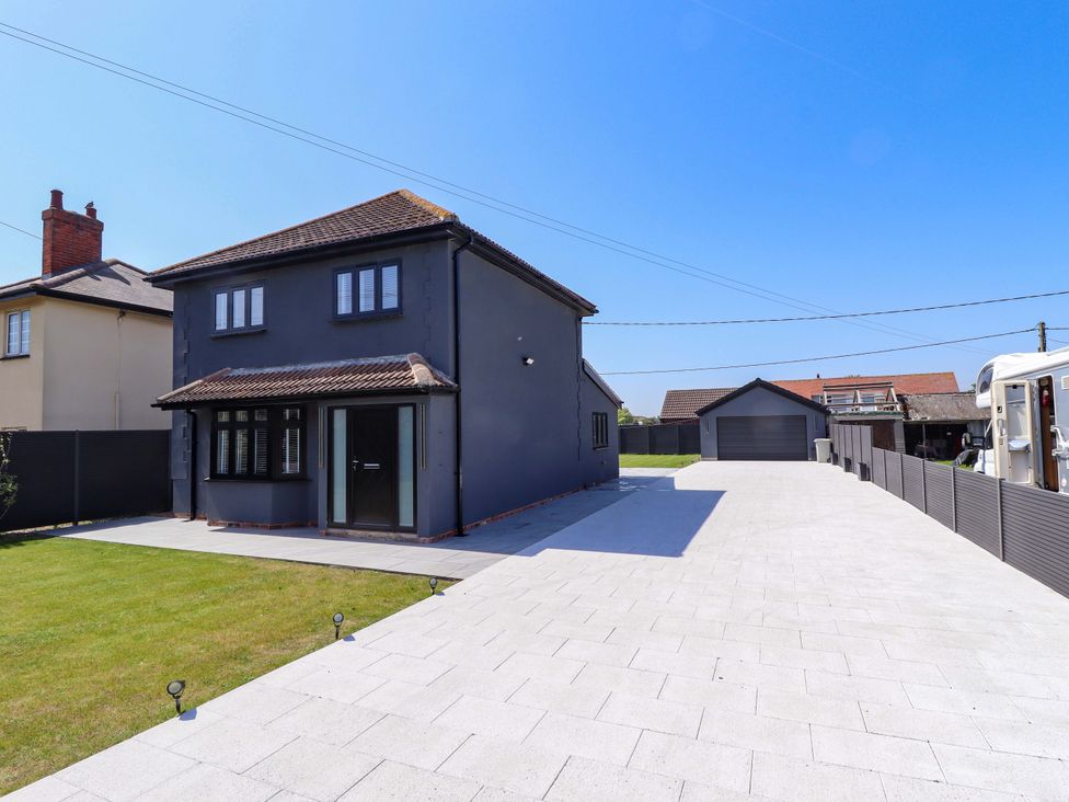 A house with a garage and driveway at 21 Anderby road