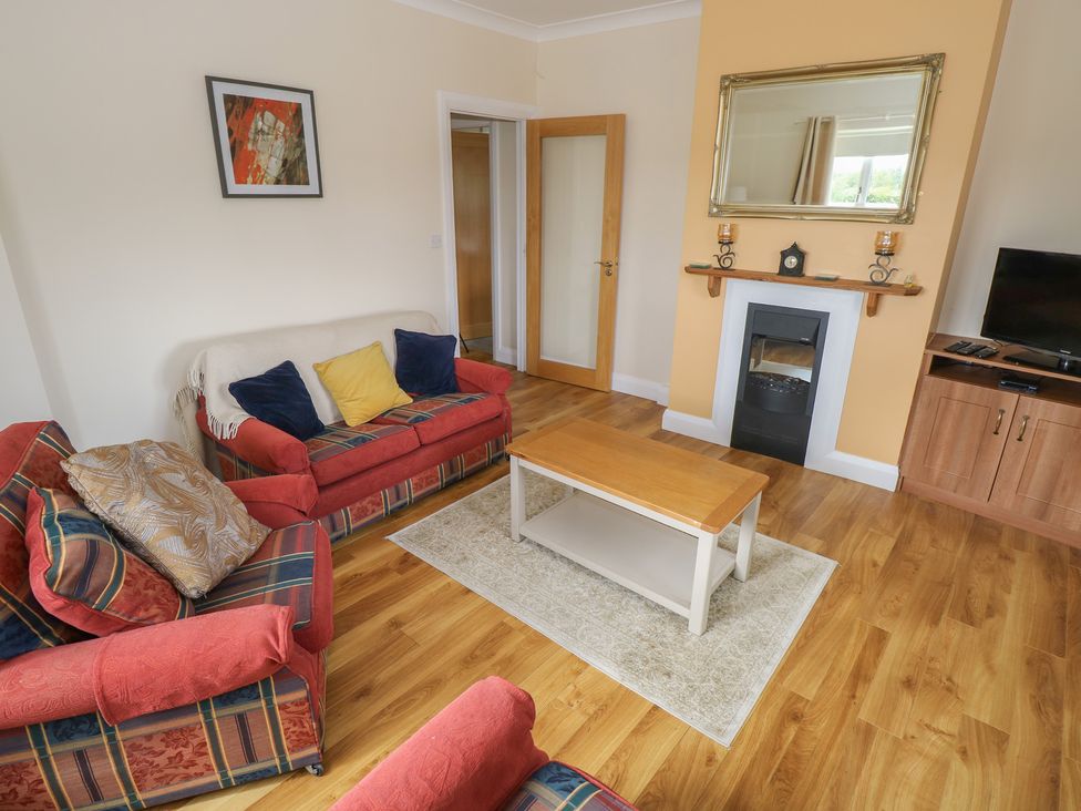 A living room with sofas and a coffee table at River House