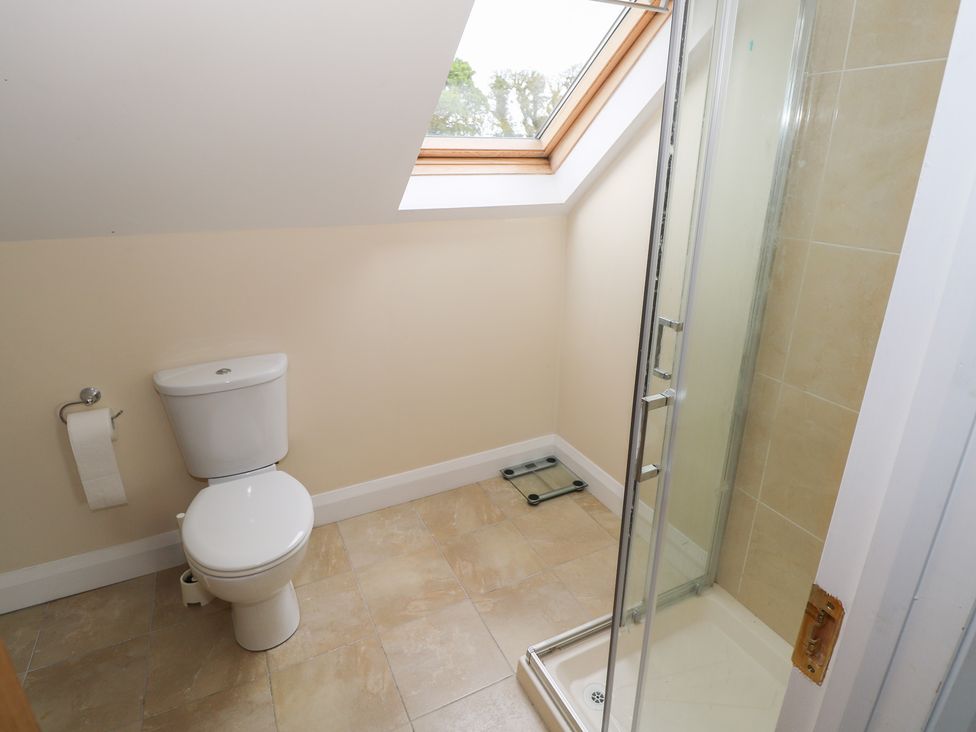 A bathroom with a toilet and shower at River House