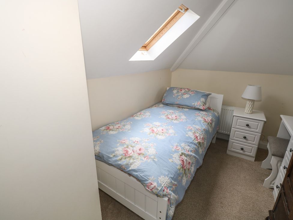 A bedroom with a bed and nightstand at River House