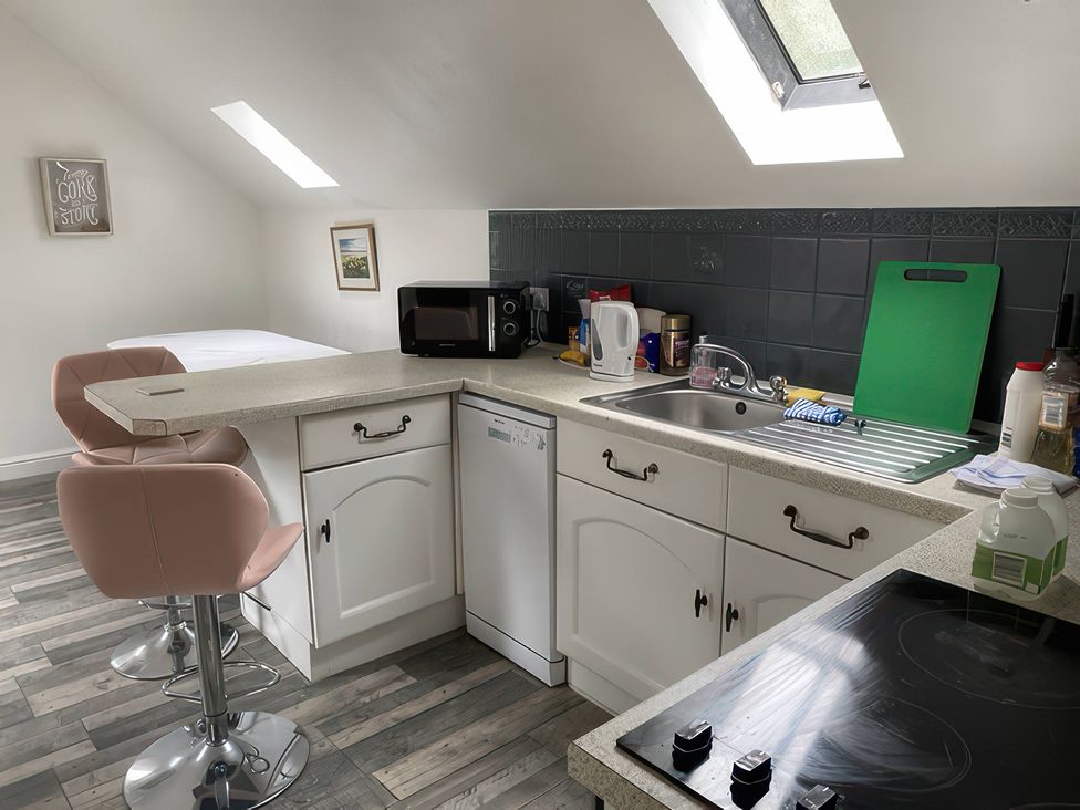 A kitchen with a sink and appliances at The Cottage in Stokesley