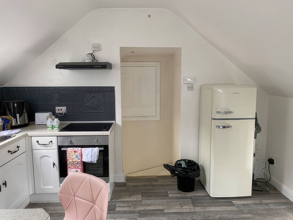 A kitchen with a fridge and oven at The Cottage in Stokesley
