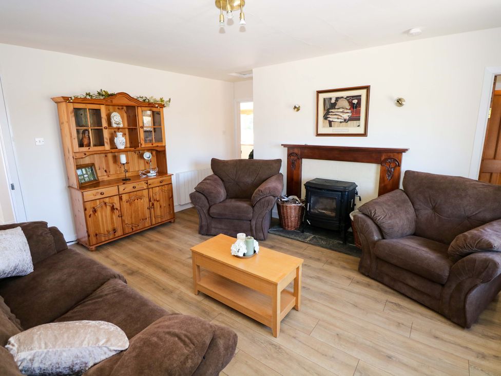 A living room with sofas and a coffee table at Cahir Cottage, Ballinrobe, County Mayo