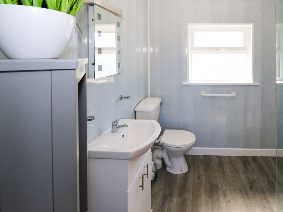 A bathroom with a sink and toilet at Cahir Cottage in Ballinrobe, County Mayo