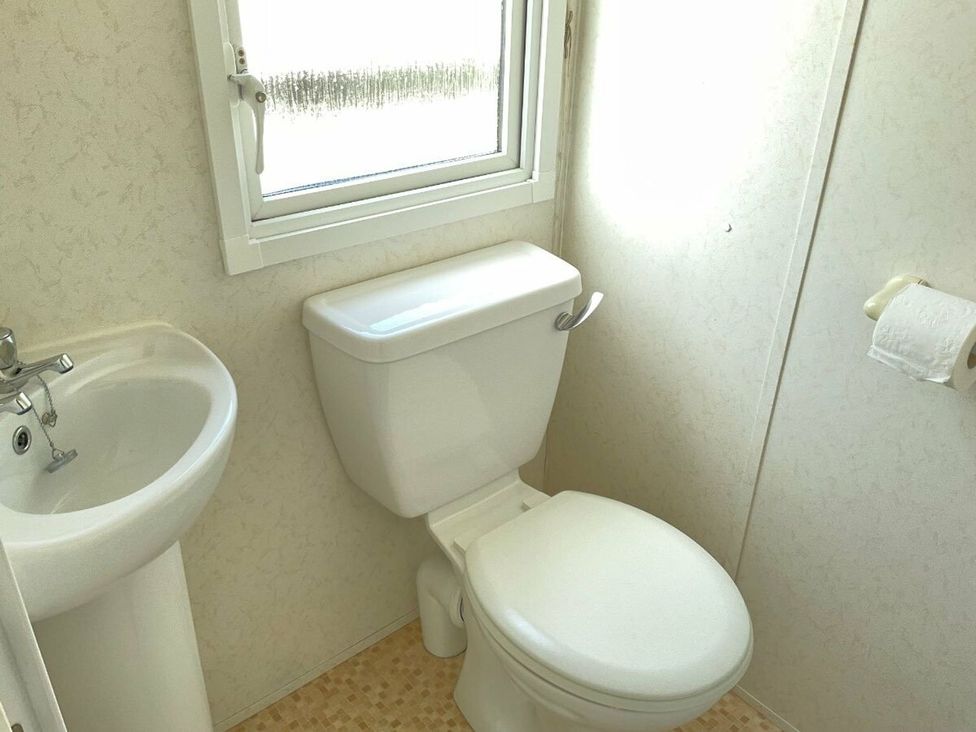 A bathroom with a sink and toilet at St Monans Holiday Park - Holiday Accommodation 19927 Anstruther